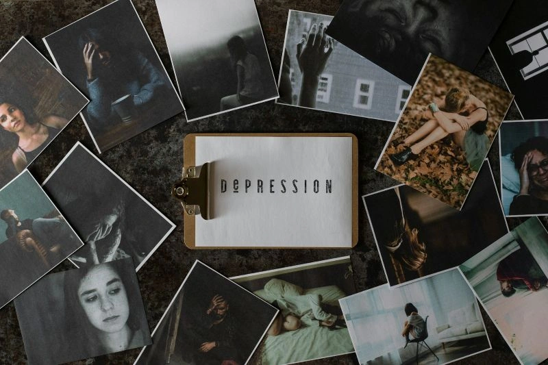 Tabletop collage of photos labeled “DEPRESSION,” showing multiple emotional scenes, representing visual patterns in signs depression is getting worse.