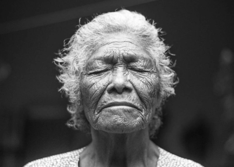 Anxiety in the elderly illustrated by a close-up portrait of an older adult with a worried facial expression.