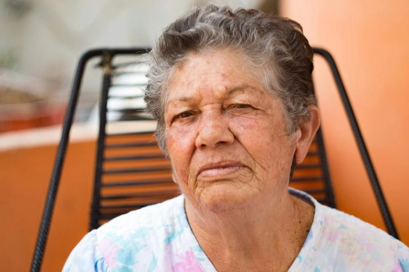Anxiety in the elderly shown by an older person sitting alone, reflecting feelings of stress, uncertainty, or emotional strain.