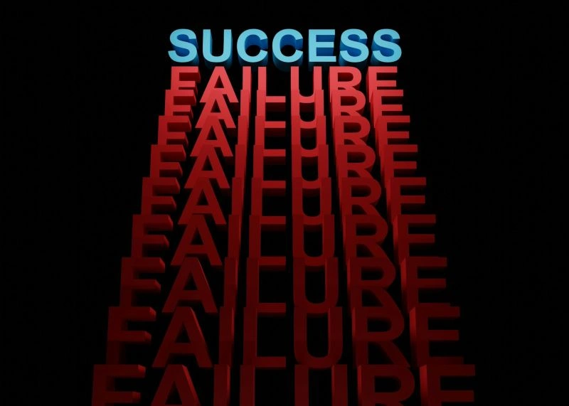 Fear of failure concept shown through stacked success and failure words, highlighting the pressure between achievement and setbacks.