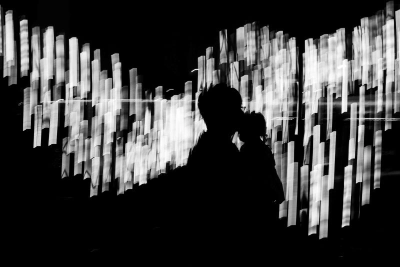 Memory lapse depicted by a blurred silhouette in a city setting, reflecting confusion and temporary memory difficulties.